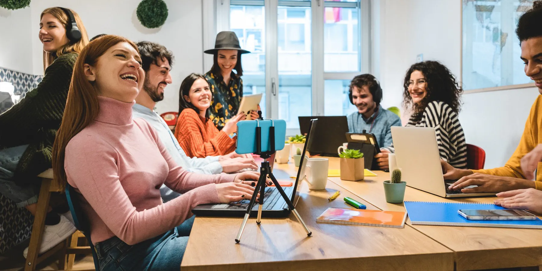 A small team working together in a bright studio